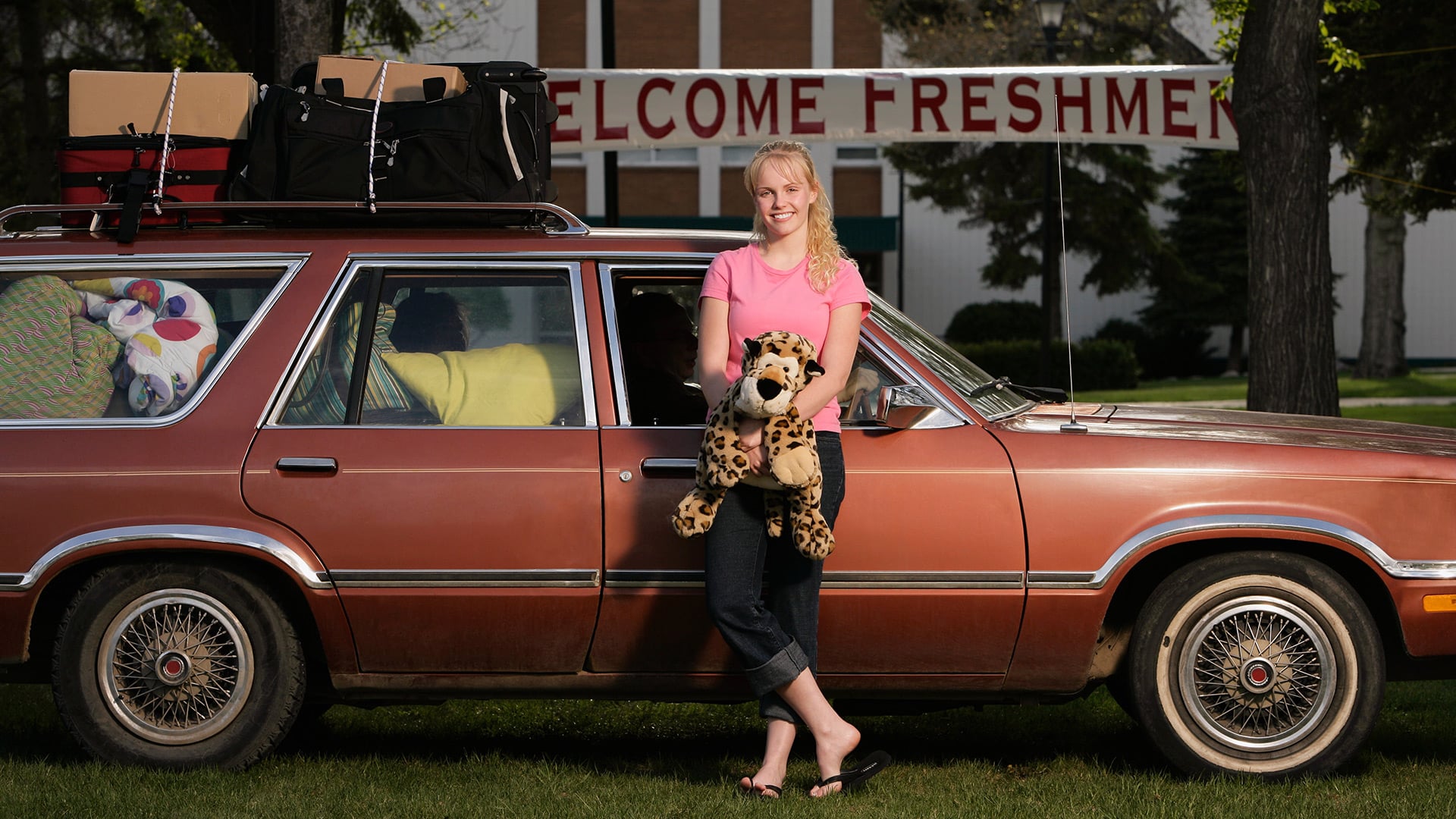 Student with her vehicle packed for college.