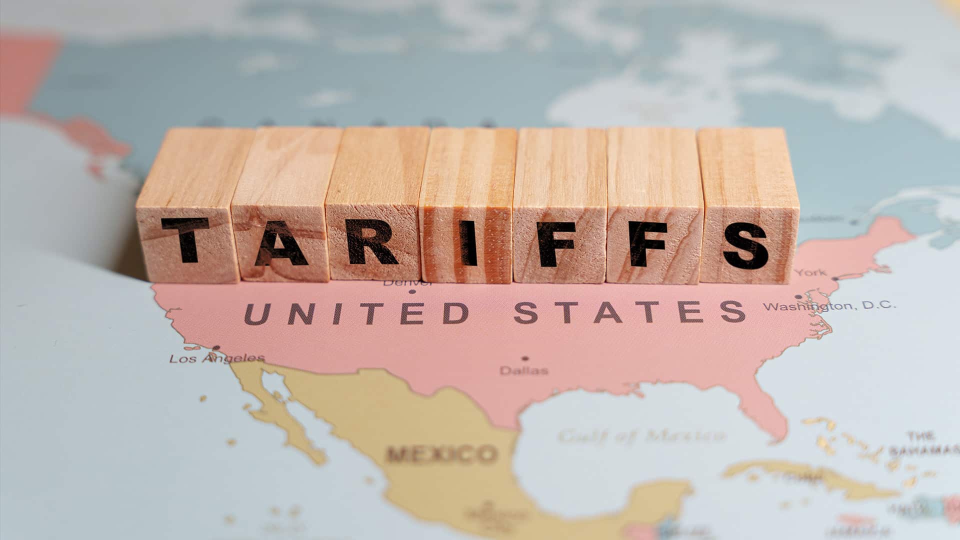 map of the united states with blocks spelling tariffs on top